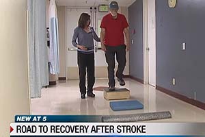 therapist and stroke recovery patient